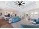Open-concept living area with stylish furnishings and easy access to both the kitchen and dining room at 497 Rotonda Cir, Rotonda West, FL 33947