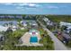 Beautiful community featuring a sparkling pool, lush landscaping, and well-maintained buildings for resort-style living at 6800 Placida Rd # 235, Englewood, FL 34224
