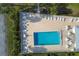 Inviting community pool area featuring ample seating, tables, and lush landscaping for relaxation and social gatherings at 6800 Placida Rd # 235, Englewood, FL 34224