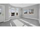 View of light-filled main bedroom with large windows and plush carpeting at 7180 Brittany Cir, Englewood, FL 34224