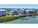 Coastal community featuring waterfront homes with private docks, lush landscaping, and serene water views at 7180 Brittany Cir, Englewood, FL 34224
