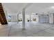 View of a spacious garage with high ceilings and overhead doors at 7180 Brittany Cir, Englewood, FL 34224