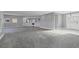 Spacious living room with neutral carpet and built-in bar at 7180 Brittany Cir, Englewood, FL 34224
