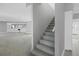 View of the spacious living room, stairs and bar area of the home at 7180 Brittany Cir, Englewood, FL 34224