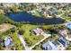 A charming lakeside home with a pool and well-maintained landscaping in a serene setting at 891 Harmony Ln, Englewood, FL 34223