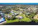Overhead view of a home with a pool in a lakeside community, highlighting the serene setting at 891 Harmony Ln, Englewood, FL 34223