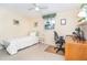 Cozy bedroom featuring a single bed, a desk area, and natural light from the window at 891 Harmony Ln, Englewood, FL 34223