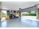 Spacious garage with ample storage space and an open garage door, providing easy access and parking at 891 Harmony Ln, Englewood, FL 34223