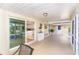 Screened patio offering access to the kitchen and outdoor space, and providing a scenic view and dining area at 891 Harmony Ln, Englewood, FL 34223