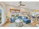 Spacious living room featuring a comfortable sectional sofa, stylish decor, and an open layout for entertaining guests at 10451 Sherman St, Englewood, FL 34224