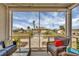Enjoy the outdoors in comfort on this screened-in porch with relaxing seating and scenic neighborhood views at 10451 Sherman St, Englewood, FL 34224