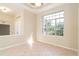 Versatile flex room featuring tile flooring, neutral walls, and a large window with neighborhood views at 12650 Montigello Ct, Englewood, FL 34223