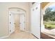 Light and bright entry featuring tile flooring and views to another room at 12650 Montigello Ct, Englewood, FL 34223
