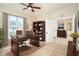 Home office featuring a desk, bookshelf, and a window with natural light at 12650 Montigello Ct, Englewood, FL 34223