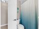 Bright bathroom with a white and blue shower curtain adding a refreshing touch at 254 Mark Twain Ln, Rotonda West, FL 33947
