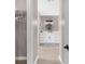 Stylish bathroom featuring modern vanity, sleek fixtures, and a well-organized closet for ample storage at 254 Mark Twain Ln, Rotonda West, FL 33947