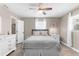 Well-lit bedroom featuring a cozy bed, a closet, and matching dressers at 254 Mark Twain Ln, Rotonda West, FL 33947