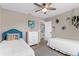 Comfortable bedroom with twin beds, ceiling fan, and decor at 254 Mark Twain Ln, Rotonda West, FL 33947