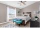 Cozy bedroom featuring a wooden bed frame and a window letting in plenty of natural light at 254 Mark Twain Ln, Rotonda West, FL 33947