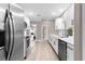 Modern kitchen featuring stainless steel appliances and ample counter space at 254 Mark Twain Ln, Rotonda West, FL 33947