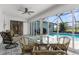 Inviting lanai with tile floors and views of the sparkling pool, perfect for relaxation at 254 Mark Twain Ln, Rotonda West, FL 33947