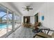 Relaxing lanai with stylish tile floors and views of the sparkling pool at 254 Mark Twain Ln, Rotonda West, FL 33947
