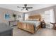Serene main bedroom with a wood accent wall, ceiling fan, and lots of space at 254 Mark Twain Ln, Rotonda West, FL 33947