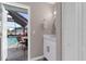A light and bright powder room adjacent to the pool and lanai at 254 Mark Twain Ln, Rotonda West, FL 33947
