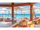 Beachside bar with stunning ocean views and relaxing seating, offering the perfect tropical getaway at 2814 Vogler Ln, North Port, FL 34286