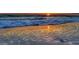 Beautiful sunset on a white sand beach with waves gently rolling in, a tranquil coastal escape at 2814 Vogler Ln, North Port, FL 34286