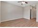 Bedroom featuring wood-look flooring, ceiling fan, recessed lighting, and white trim at 2814 Vogler Ln, North Port, FL 34286