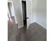 Bedroom featuring plush carpeting, neutral walls, and an open closet space at 2814 Vogler Ln, North Port, FL 34286