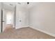 Cozy bedroom with a ceiling fan, neutral walls, plush carpet, and white trim at 2814 Vogler Ln, North Port, FL 34286