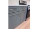 Close-up of modern gray kitchen cabinets with stainless steel handles at 2814 Vogler Ln, North Port, FL 34286