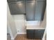 Cabinets and countertop area with white tiled backsplash at 2814 Vogler Ln, North Port, FL 34286