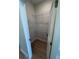 Walk-in closet with ventilated shelving and wood-look flooring at 2814 Vogler Ln, North Port, FL 34286