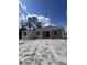 Rear exterior view of a single-story home with a covered patio at 2814 Vogler Ln, North Port, FL 34286