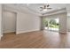 Living room boasting recessed lighting, wood-look flooring, and sliding glass doors to a patio at 2814 Vogler Ln, North Port, FL 34286