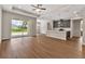 Open-concept living area showcasing modern kitchen with large island and stainless appliances adjacent to the living room at 2814 Vogler Ln, North Port, FL 34286