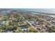 Aerial view of a neighborhood featuring waterfront access and scattered vegetation at 539 Shore Rd, Nokomis, FL 34275