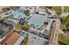 Aerial view of a fenced property with tropical landscaping, patio and a white gravel yard at 539 Shore Rd, Nokomis, FL 34275