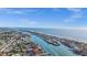 Expansive aerial view of waterfront community nestled between the river and the ocean under a bright blue sky at 539 Shore Rd, Nokomis, FL 34275