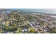 Aerial view of a neighborhood featuring waterfront access and scattered vegetation at 539 Shore Rd, Nokomis, FL 34275