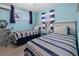 Nautical themed bedroom with two twin beds and blue walls for a seaside retreat at 539 Shore Rd, Nokomis, FL 34275