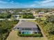 Beautiful aerial view of the home featuring a screened-in pool and lush landscaping at 7442 Clearwater St, Englewood, FL 34224