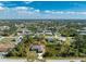 Aerial view showing a well-landscaped single Gathering home in a residential neighborhood at 7442 Clearwater St, Englewood, FL 34224