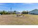 Expansive backyard featuring a fire pit area, perfect for outdoor gatherings and relaxation at 7586 Sea Mist Dr, Port Charlotte, FL 33981
