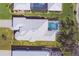 An aerial view of this well maintained property with pool, landscaping, and nice roof at 109 Westwind Dr, Placida, FL 33946
