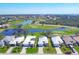 Aerial view of a picturesque community with golf courses and waterfront homes at 109 Westwind Dr, Placida, FL 33946