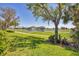 Beautiful backyard view of the golf course and scenic pond at 109 Westwind Dr, Placida, FL 33946